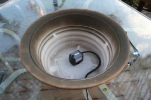 Installing the pump in the large pot